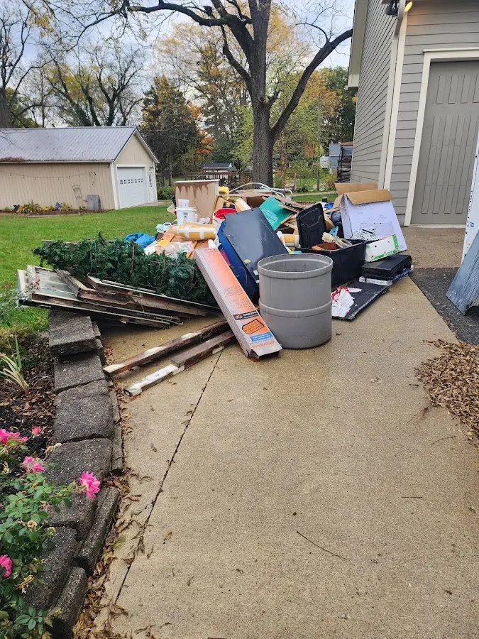 Dumpster being loaded with debris for Commercial Dumpster Rental in Millington